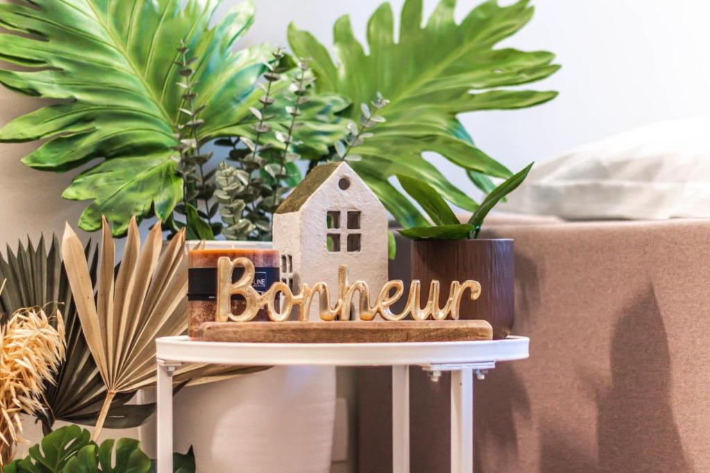 a small house on a table next to a couch at Home Studio Luxury in Milan