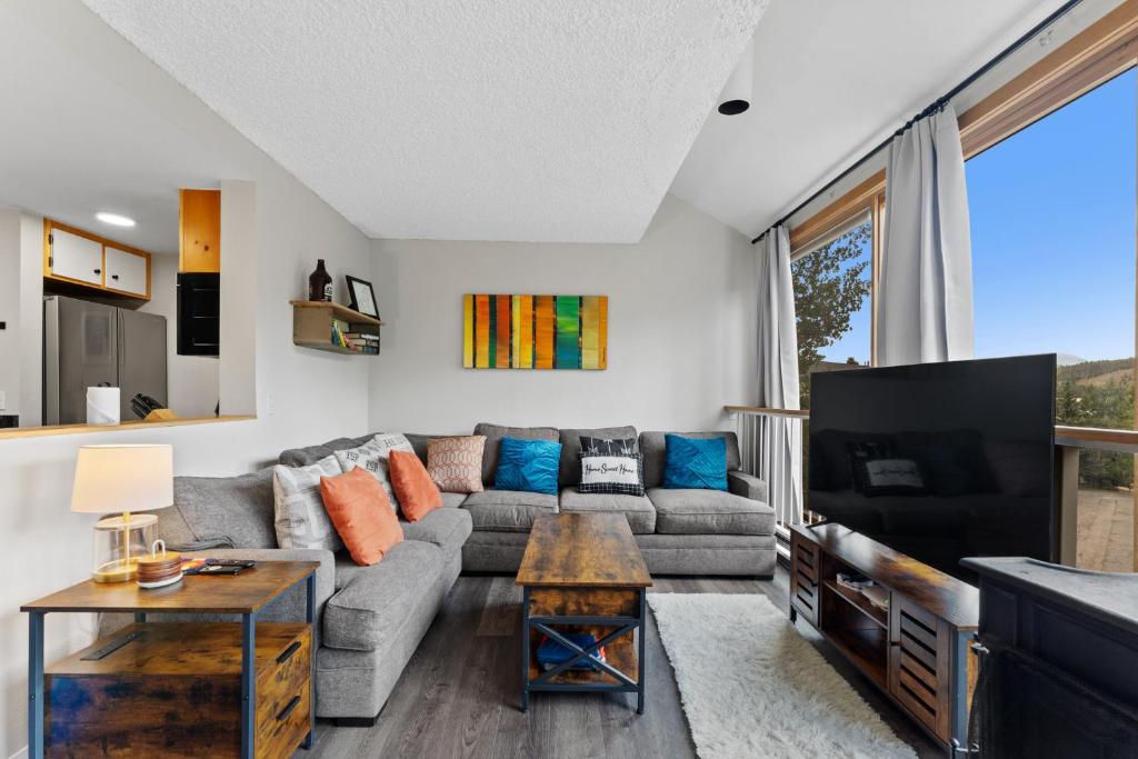 a living room with a couch and a tv at Decatur #1797 in Keystone