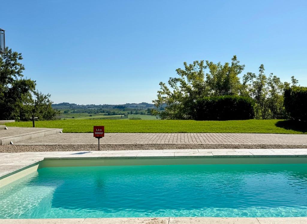 a swimming pool with a no swimming sign next to it at Casa MIA - tra Monferrato, Langhe e Roero in CastellʼAlfero