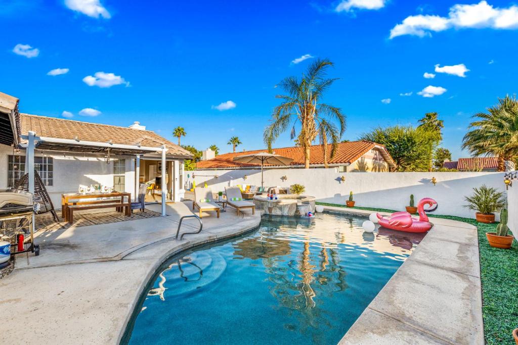 a swimming pool in a backyard with a house at Desert Fun 5BR Retreat with Pool in Bermuda Dunes