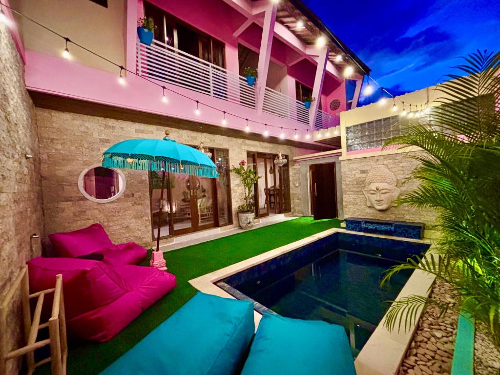 a house with a swimming pool in the yard at Bali Dream Beach House - Family Friendly Villa in the Heart of Sanur Beach, Cafes, Market & Shopping in Sanur