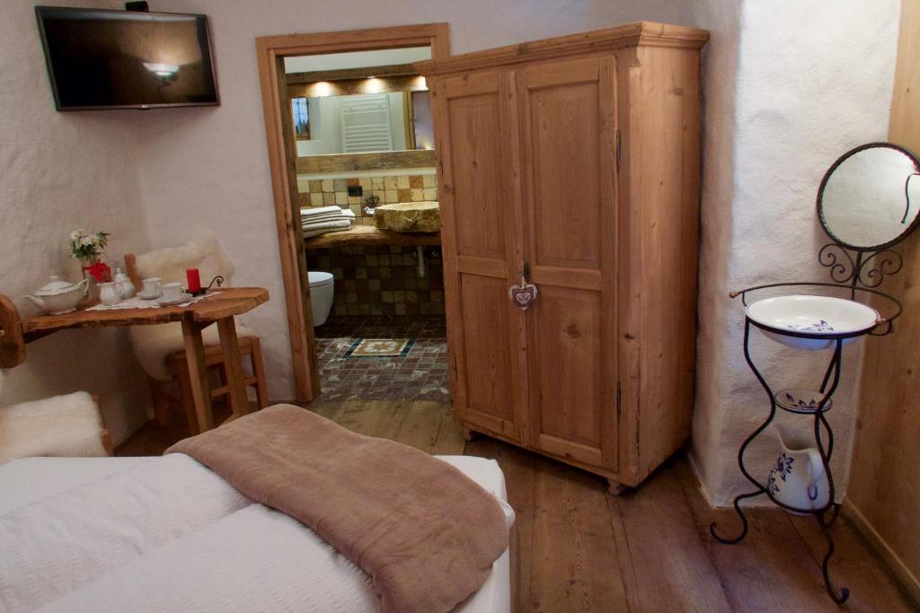 Postel nebo postele na pokoji v ubytování Agriturismo Baita De L'ALL