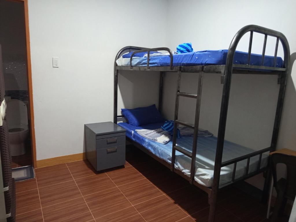 a couple of bunk beds in a room at Sarah's Garden BnB & Spa in Tontunan