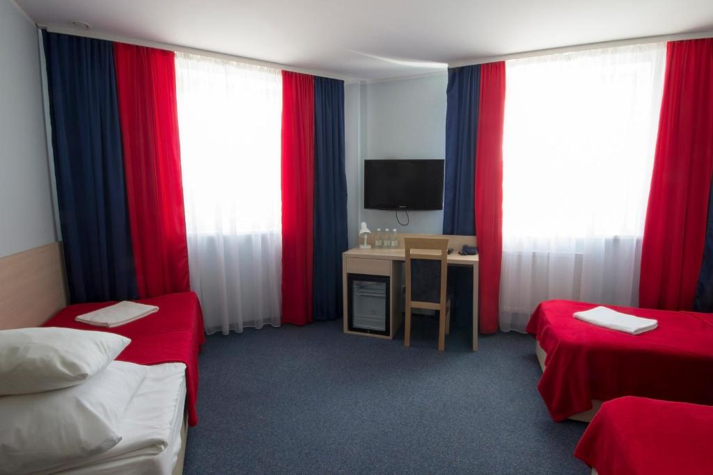 Łóżko lub łóżka w pokoju w obiekcie Hotel Czarna Perła