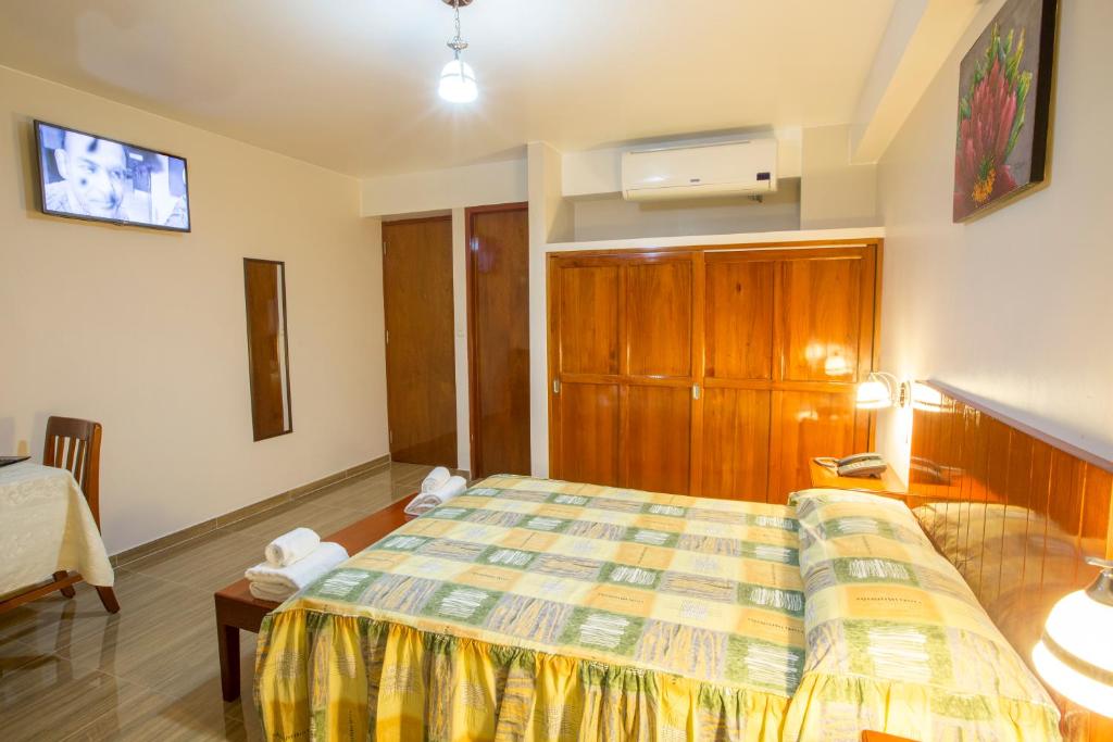 Postel nebo postele na pokoji v ubytování Amazonia Siu Hostal