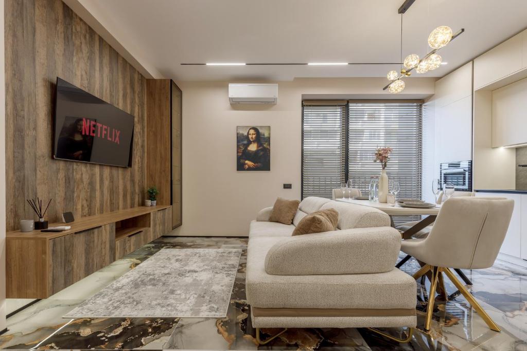 a living room with a couch and a table at Renest Florence Art Escape in Chişinău