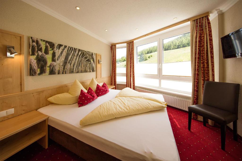 Postel nebo postele na pokoji v ubytování Hotel Appart Peter