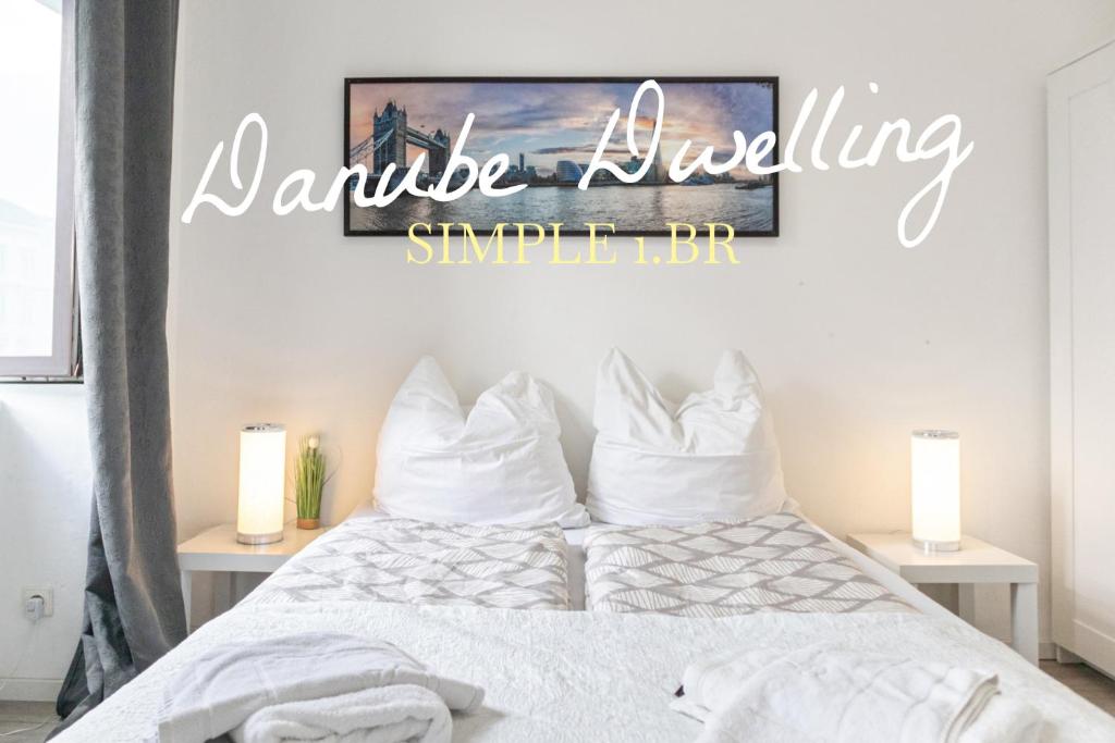 a bedroom with a bed with a sign that reads marble bubbling sample bar at Budget 1BR Studio near Danube & Millenium Tower in Vienna