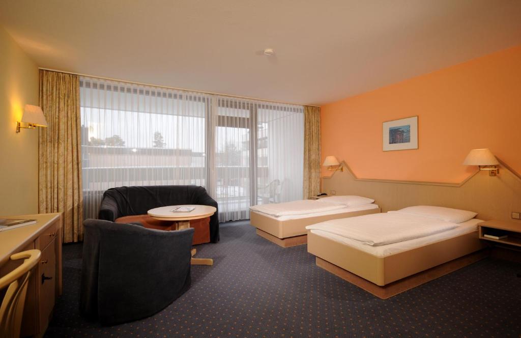 Postel nebo postele na pokoji v ubytování Hotel Sonnenhügel