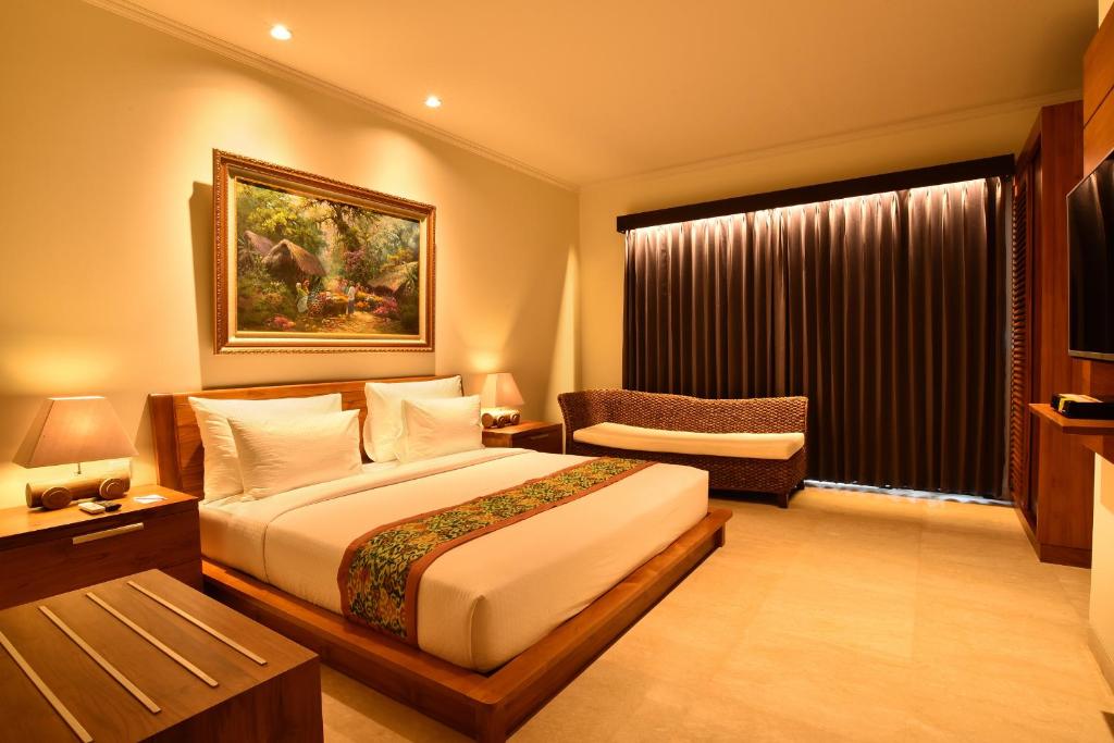 Postel nebo postele na pokoji v ubytování Ubud Wana Resort
