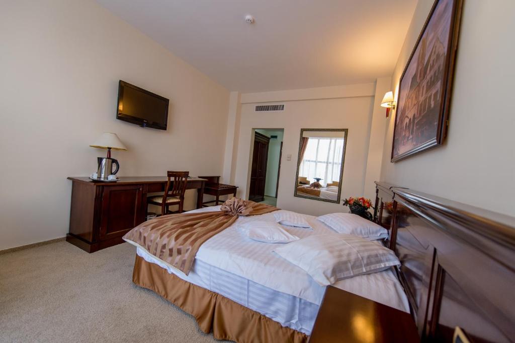 Postel nebo postele na pokoji v ubytování Hotel Rexton