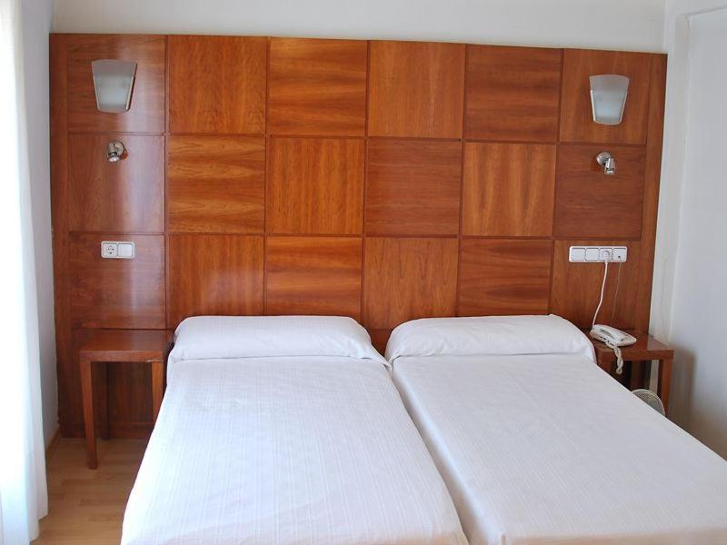 Postel nebo postele na pokoji v ubytování Hotel Trefacio