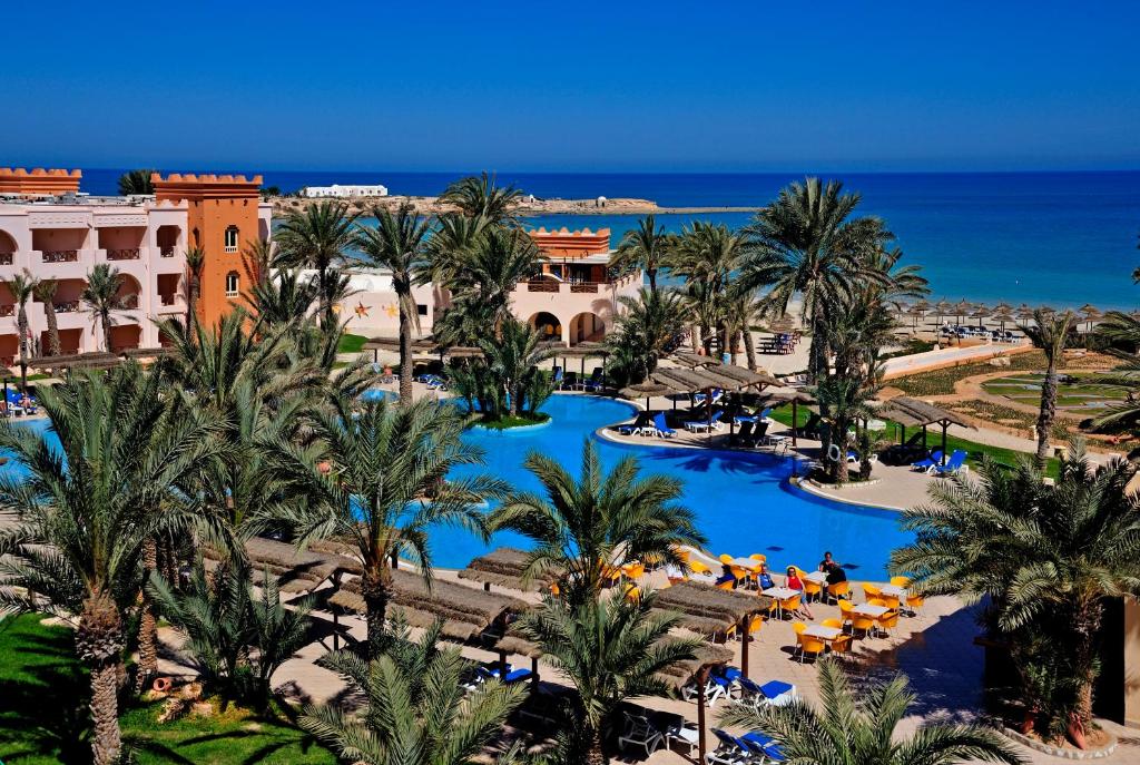 an aerial view of a resort with palm trees and pools at Vincci Safira Palms in Sangho