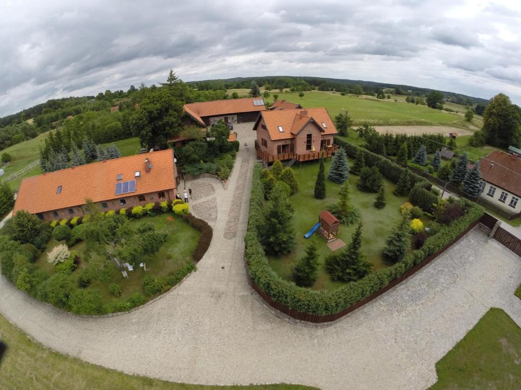 an aerial view of a large house with a yard at Stajnia Lipowo 45 in Lipowo