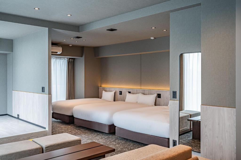 Postel nebo postele na pokoji v ubytování Apartment Hotel 11 Asakusa 2