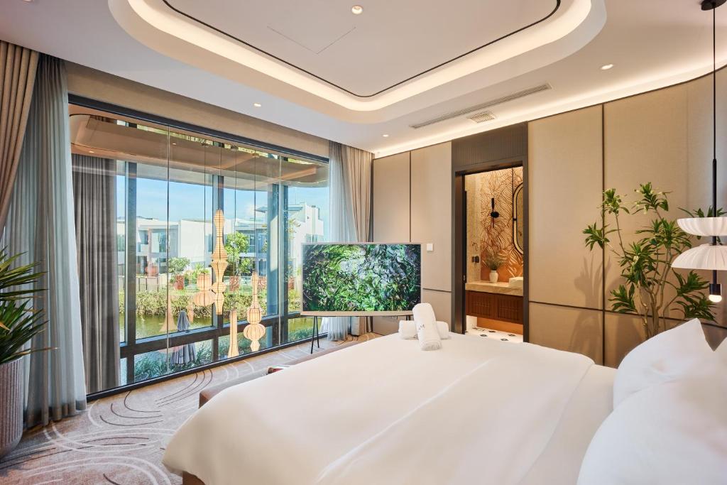 Ένα ή περισσότερα κρεβάτια σε δωμάτιο στο Lux Annam Retreat Danang