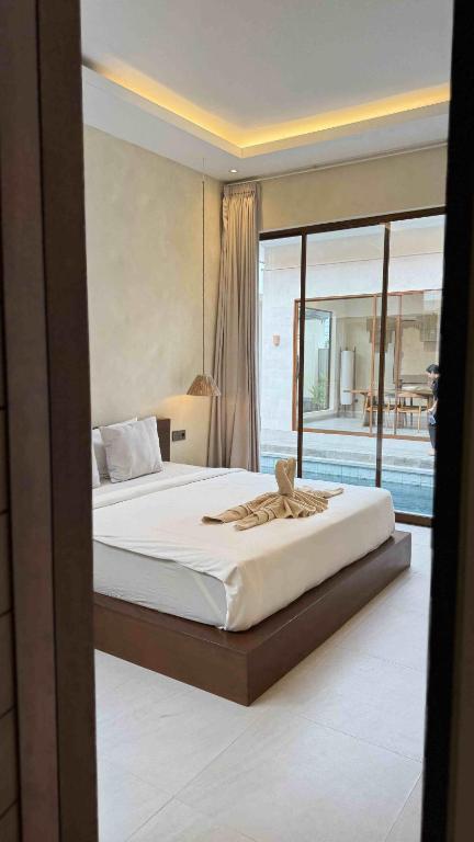 Postel nebo postele na pokoji v ubytování The R Villa Talang - Brand New Near Beach & Stunning Sunsets