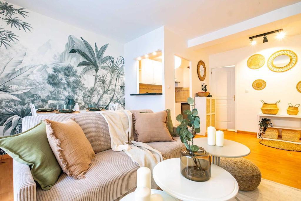 a living room with a couch and tables at 4 Guests Flat - Place Monge in Paris