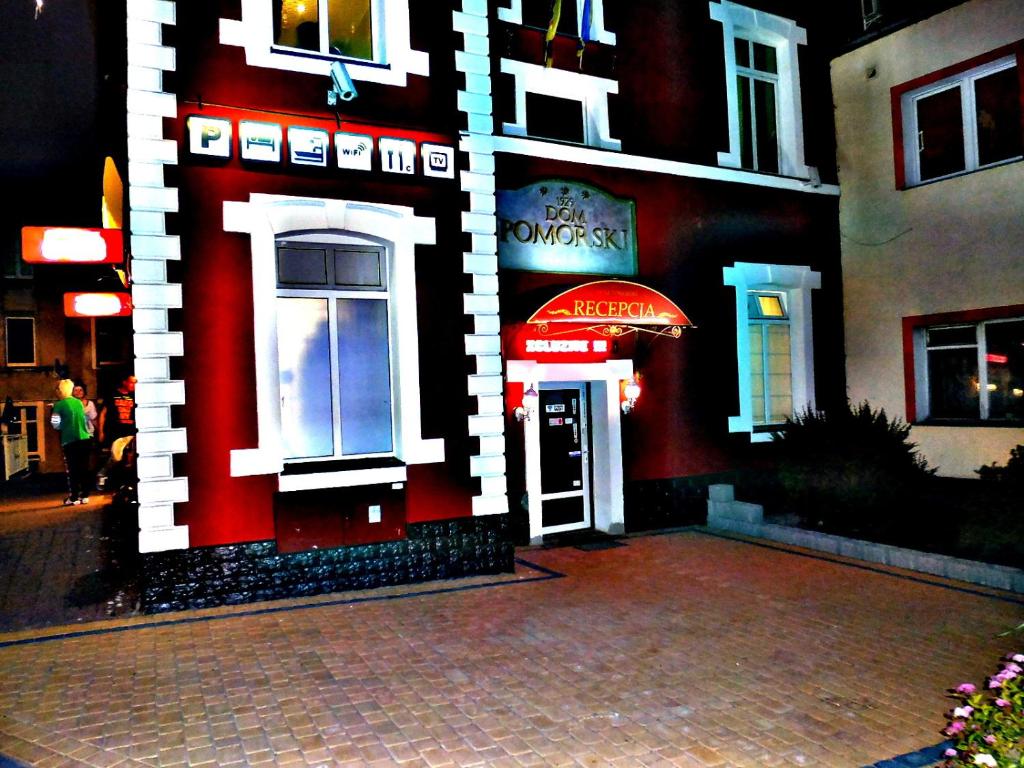 a building with a lego house on the side of it at Dom Pomorski in Miastko