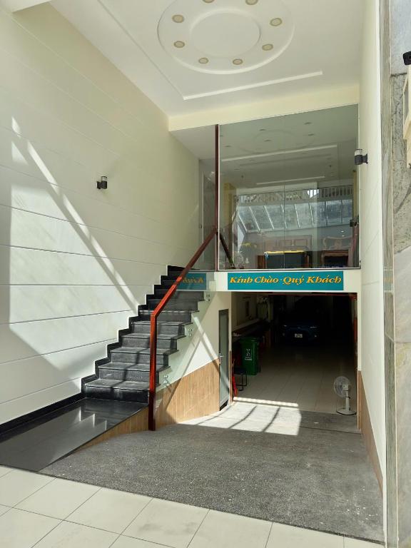a hallway with a staircase in a building at DŨNG India HOTEL in Ho Chi Minh City