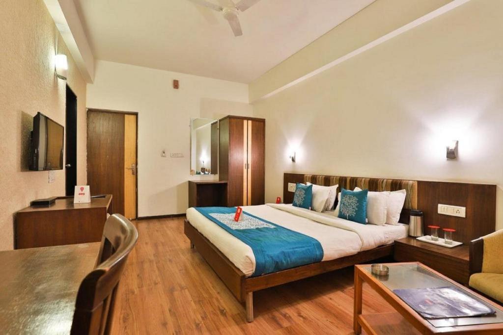 Ένα ή περισσότερα κρεβάτια σε δωμάτιο στο Hotel President Inn, Gandhinagar
