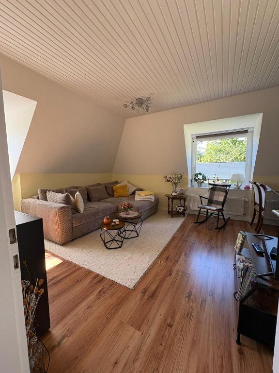 a living room with a couch and a table at Haus Lönsweg in Bad Bevensen