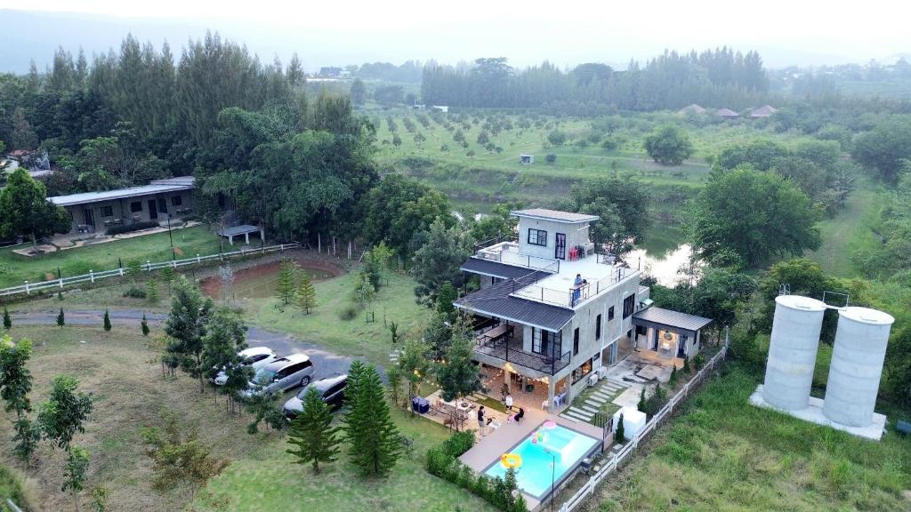 an aerial view of a house with a pool at Honeymoon Moonlight Khaoyai in Ban Tha Wua Tai
