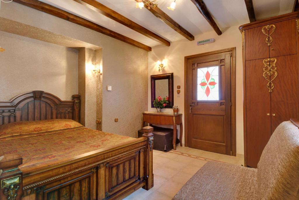 Postel nebo postele na pokoji v ubytování Nikolaou House
