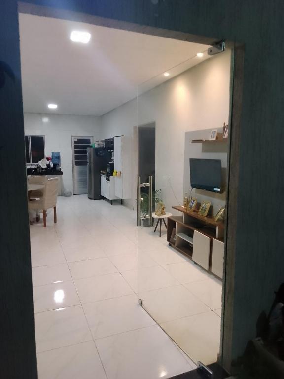 a view of a living room with a large mirror at Casa dos sonhos in Viçosa do Ceará