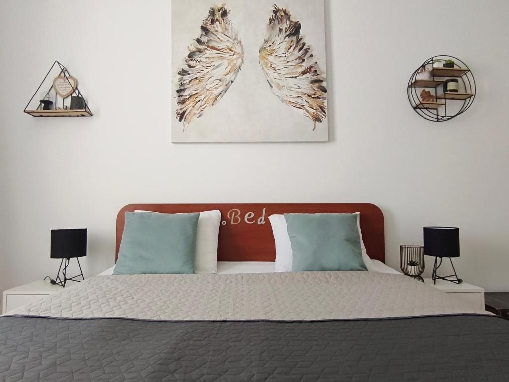 Postel nebo postele na pokoji v ubytování Apartment Angelus