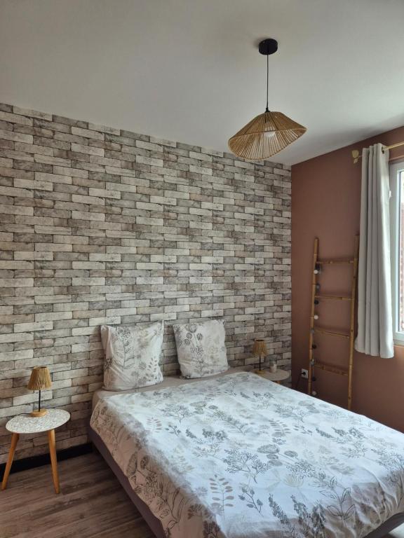 Ένα ή περισσότερα κρεβάτια σε δωμάτιο στο Le Millésime