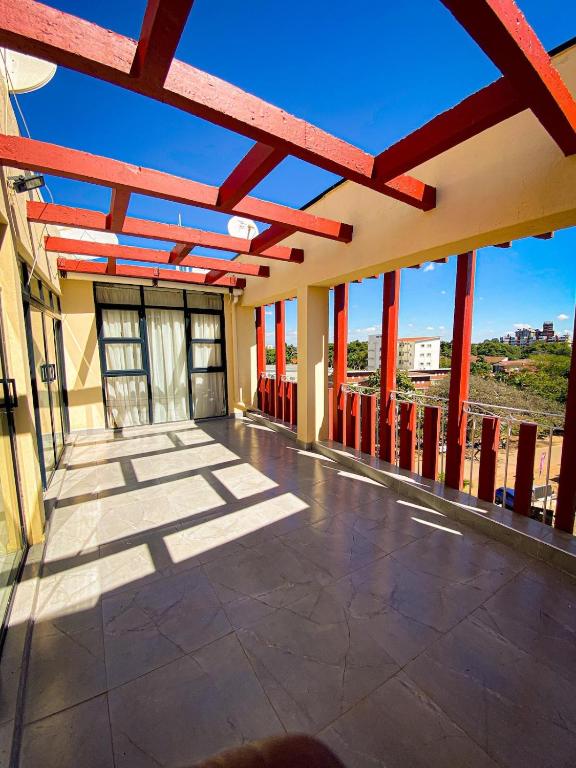 a view of a building with red beams at Cozy Up on 5th in Harare