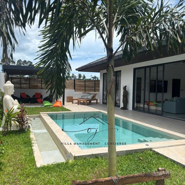 a swimming pool in front of a house at Villa Selva, Lamai in Amphoe Koh Samui