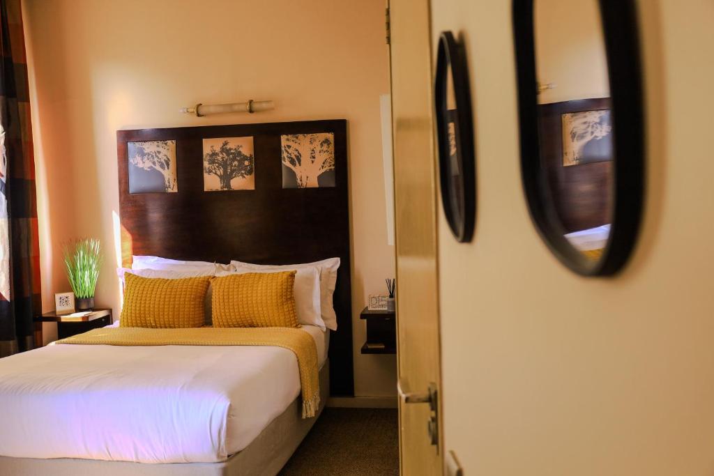 En eller flere senge i et værelse på Modern Bachelor