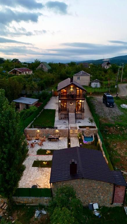 an aerial view of a large house with a patio at Villa Stone House in Kutaisi Heliport
