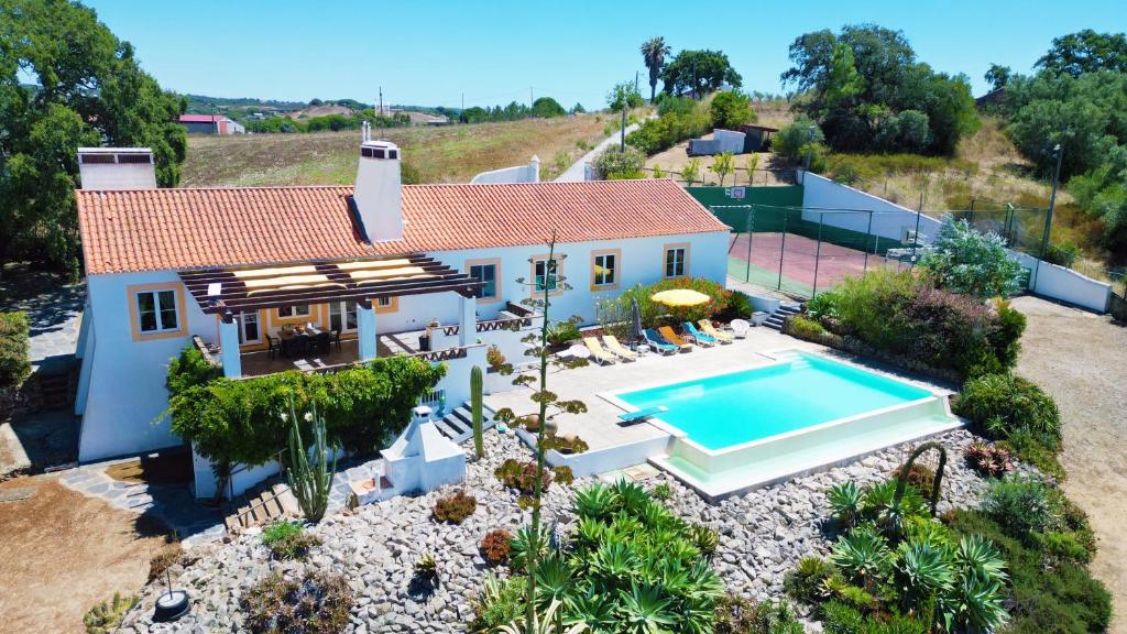 an aerial view of a house with a swimming pool at Monte da Casa Telhada in Santiago do Cacém