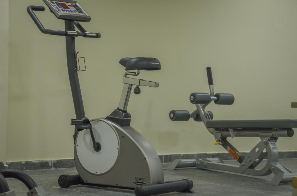 a gym with two exercise bikes in a room at Thassos Imperial Resort in Skala Rachoniou