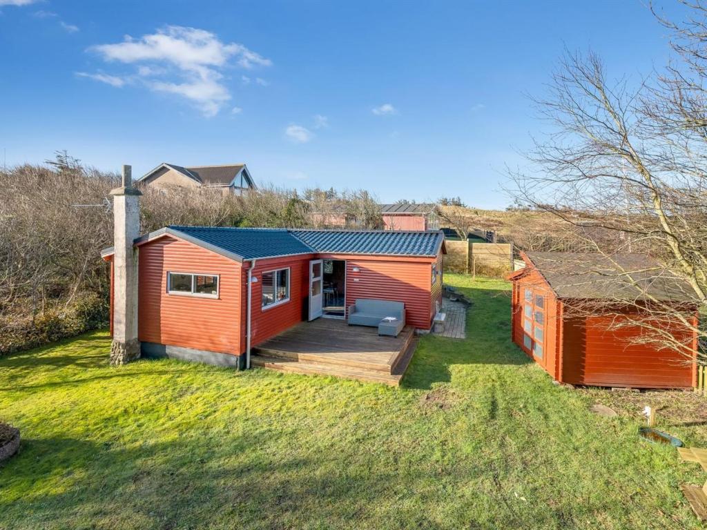 a home with a deck and a house at Holiday Home Alpi - 250m to the fjord by Interhome in Struer