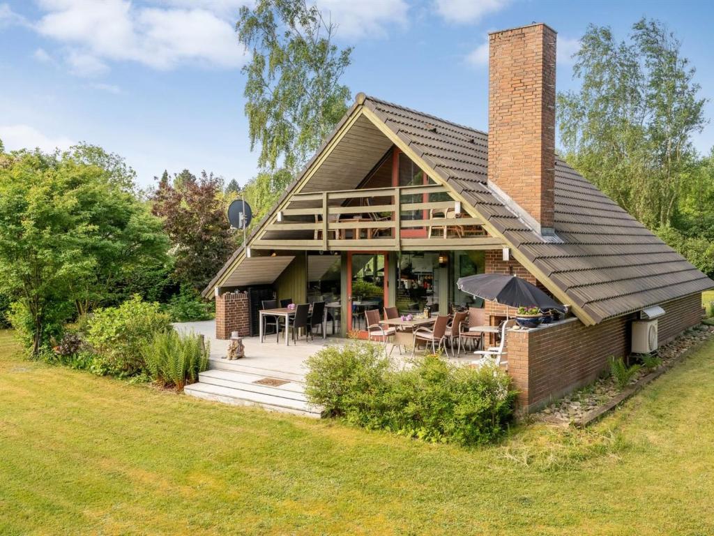 a home with a brick house with a patio at Holiday Home Paale - 200m to the fjord by Interhome in Fur