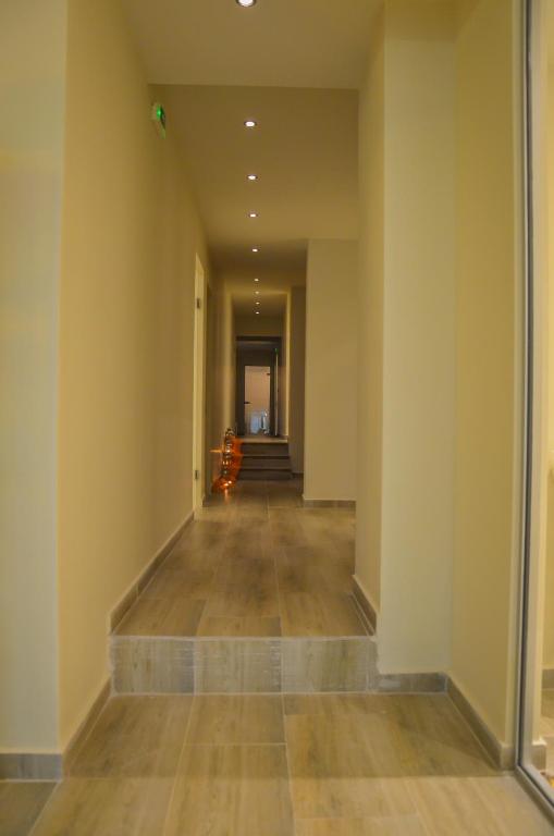an empty hallway with a staircase in a building at Thassos Imperial Resort in Skala Rachoniou