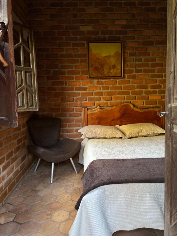 Postel nebo postele na pokoji v ubytování Suíte Oriente Vale do Capão