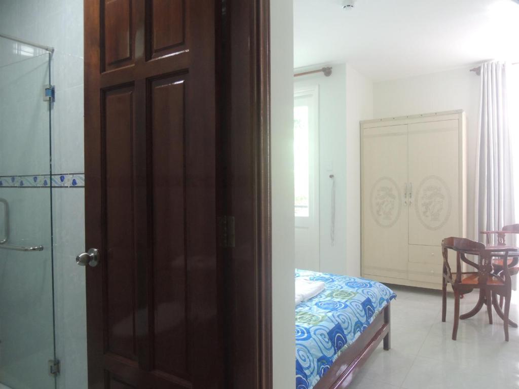 Postel nebo postele na pokoji v ubytování Hotel Khoa Văn