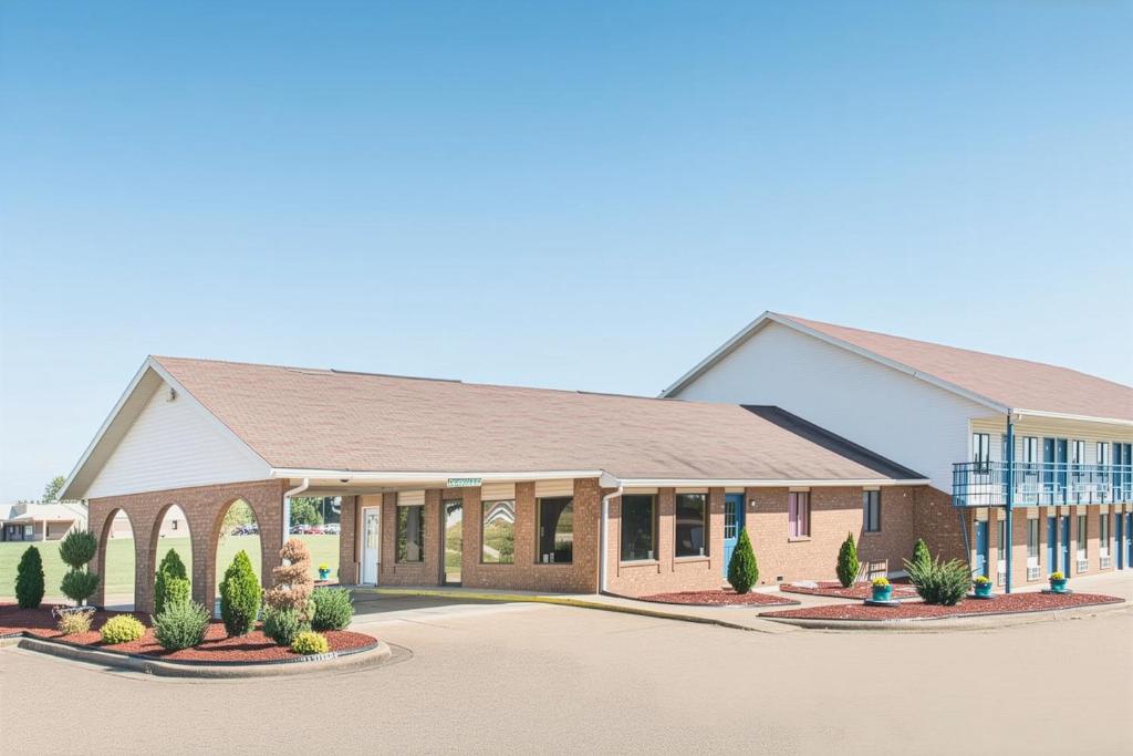 a rendering of the front of a school building at Cactus Inn and Suites in Mountain Grove