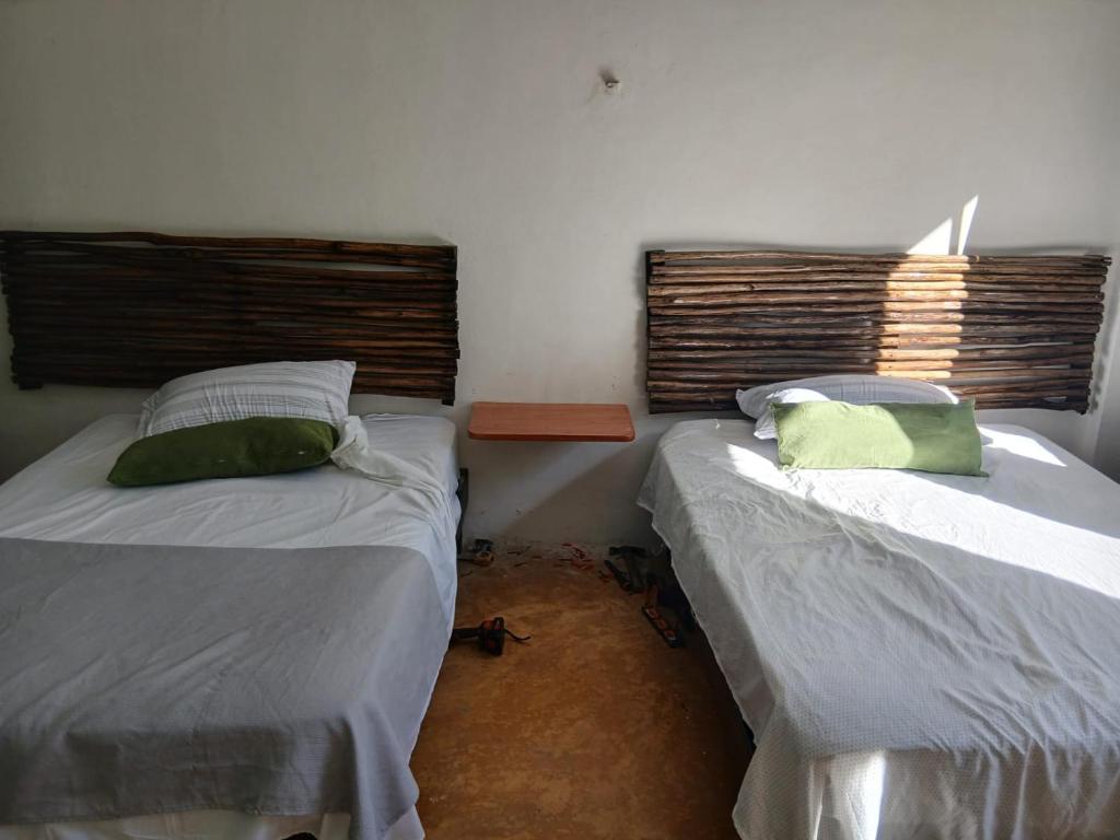 Ένα ή περισσότερα κρεβάτια σε δωμάτιο στο Fosch Hostel