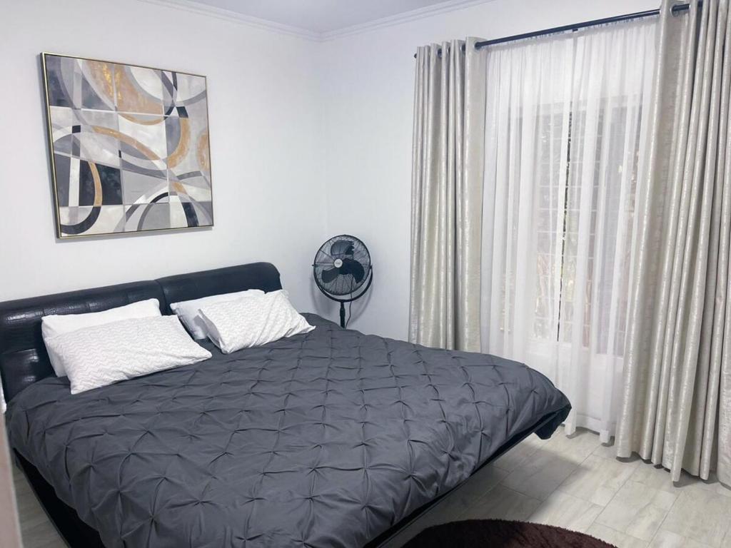 Ένα ή περισσότερα κρεβάτια σε δωμάτιο στο Luxury 3 BR in Gated Community