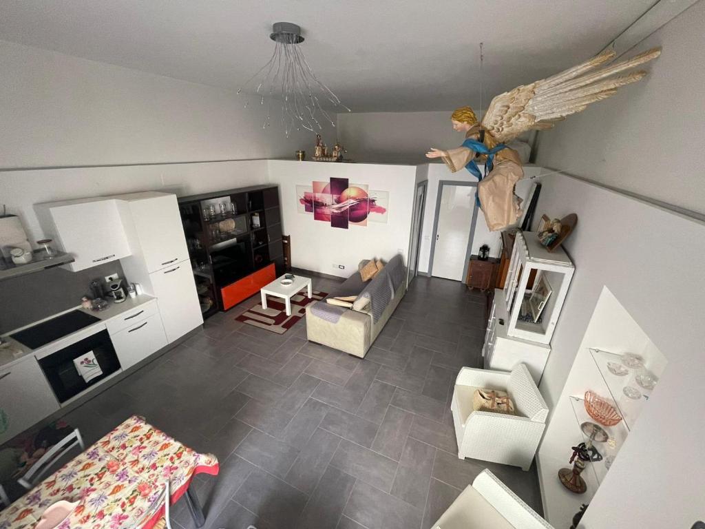 an aerial view of a living room with an angel hanging from the ceiling at Casa vacanze a Matera - MatyLove in Matera