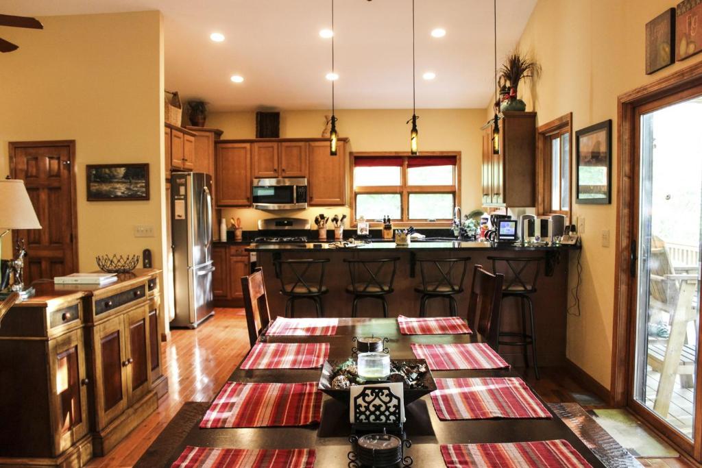 a kitchen with a table and a counter top at Eagle Rock in Beech Mountain
