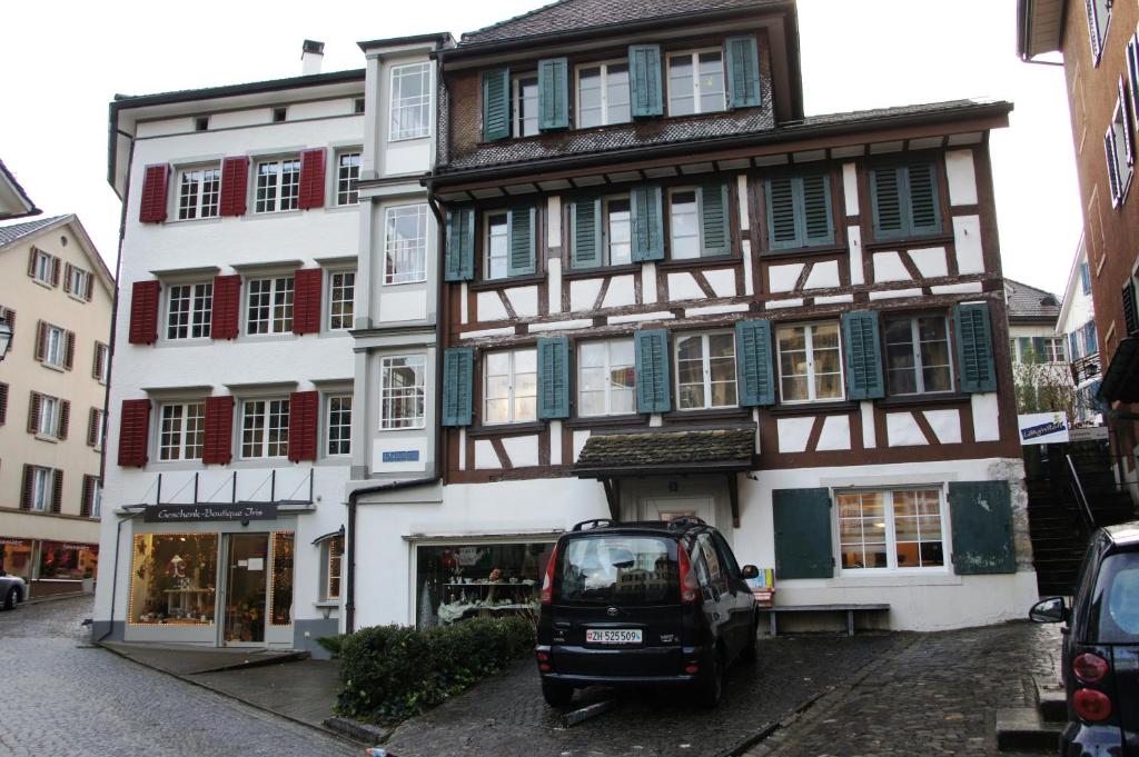 a small car parked in front of a building at Studio-Appartment Horgen in Horgen