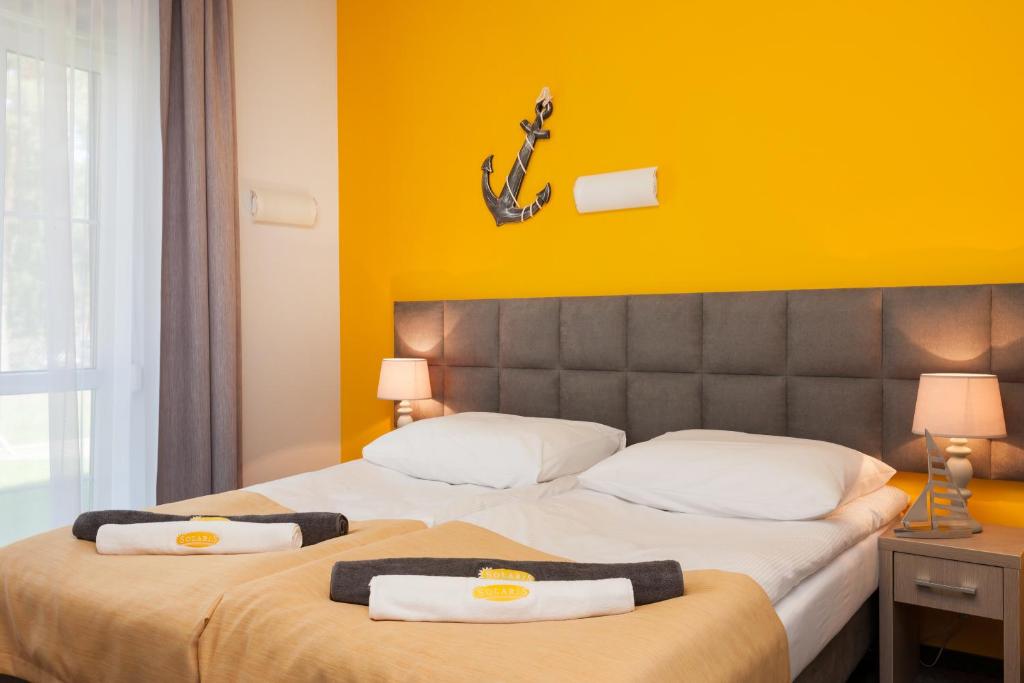 Postel nebo postele na pokoji v ubytování Solaris