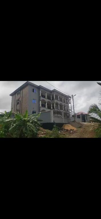 a large building on top of a hill at Hima resident in Limbe